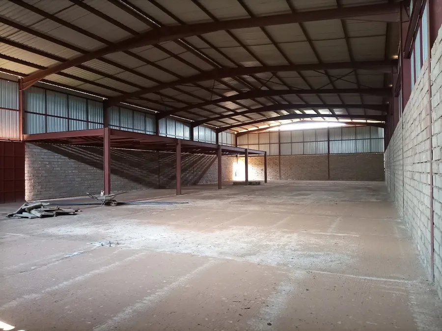 Interior of Pio Ltd spacious industrial and business warehouse for rent in Kampala with high ceilings and optimized storage