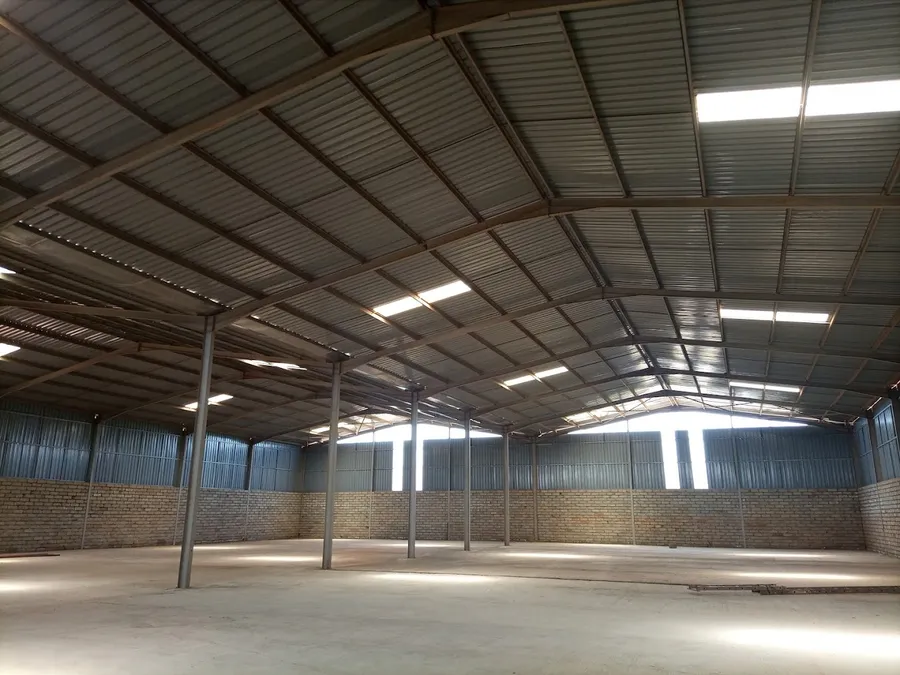 Interior of Pio Ltd spacious industrial and business warehouse for rent in Kampala with high ceilings and optimized storage