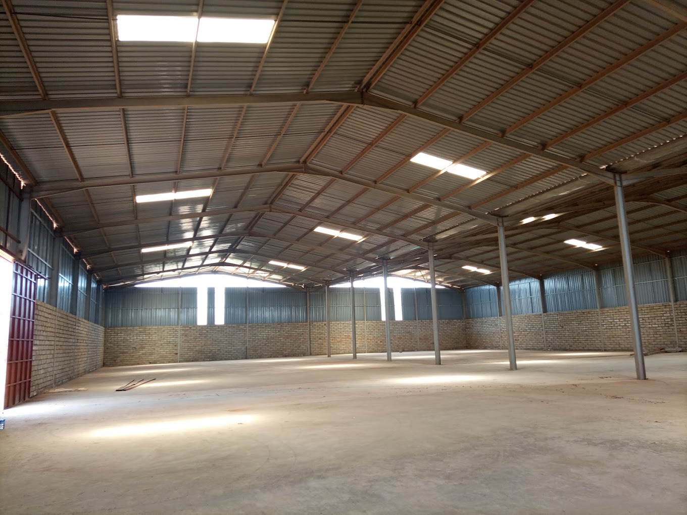 Interior of a spacious warehouse for rent in Kampala optimized for storage