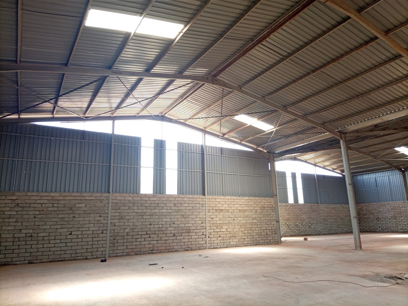 Interior of pio ltd spacious industrial and business warehouse for rent in Kampala with high ceilings and optimized storage